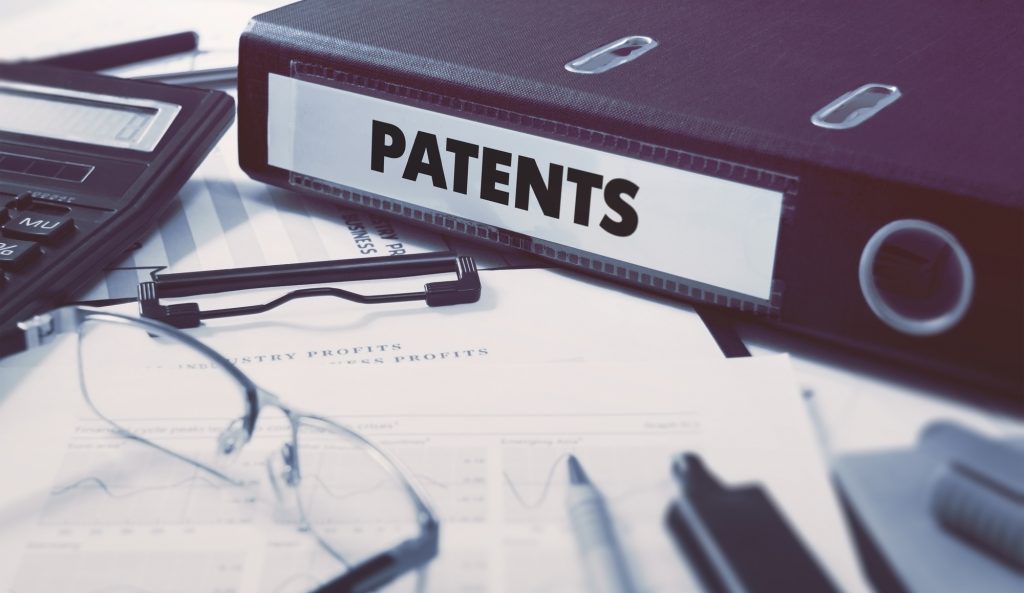 Binder with Inscription Patents on Desk