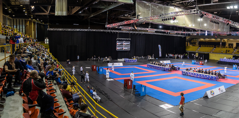 Karate Event On A Stadium - Multi Number Of Sport Athletes Getting Prepared For The Competition.