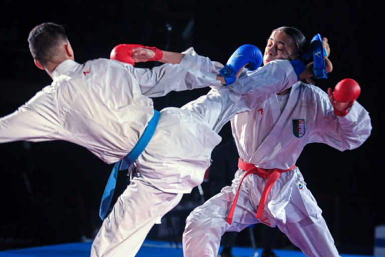 Two Male Martial Art Fighters On Action In Their Karate Training Session.