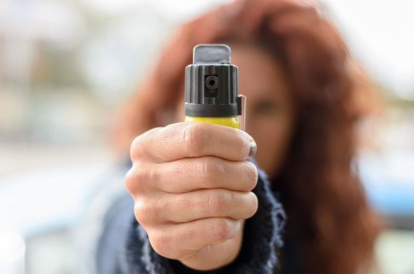 A Close-Up Shot Of A Woman Holding A Pepper Spray For Her Self Defense.
