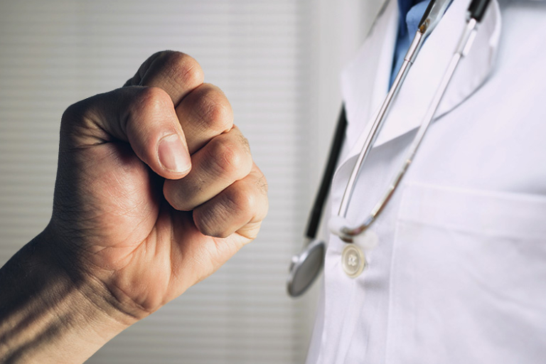 A Man Trying To Punch The Doctor.