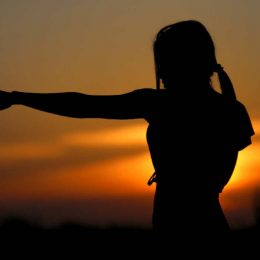 A Silhouette Of Young Woman On Her Martial Art Training In The Early Morning.