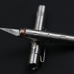 Pen Knife Placed On The Table - Self Defense Weapon.