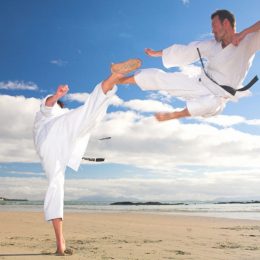 A Man Defending Another Man In Martial Art Training Session.