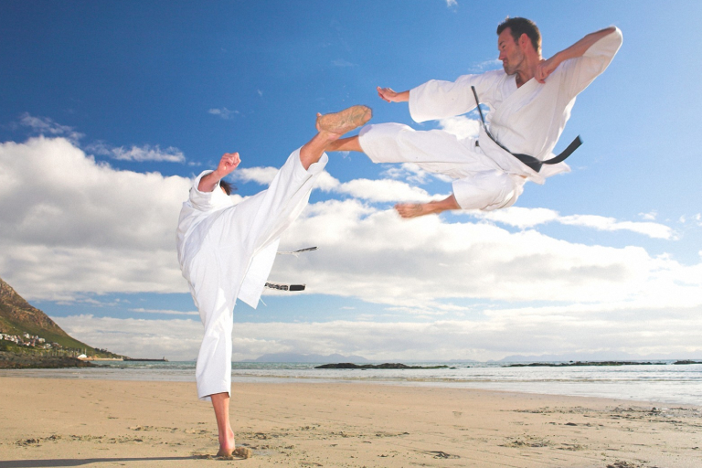 A Man Defending Another Man In Martial Art Training Session.