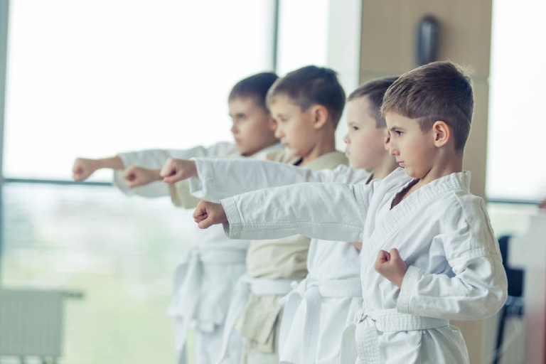 Group Of Little Kids In Their Karate Training Session.
