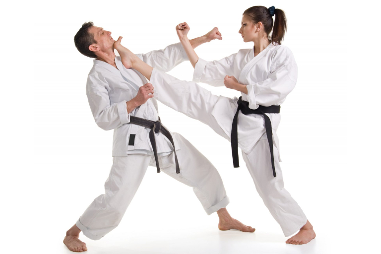 A Female Fighter Doing Front Kick On Her Defender.