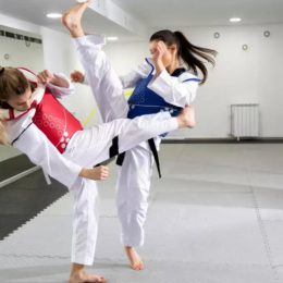 Two Female Karate Trainers In Action.