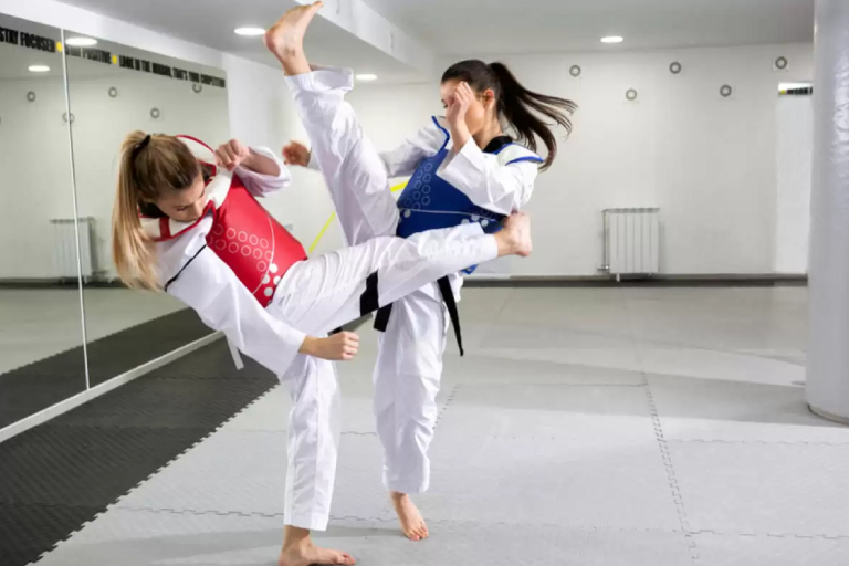 Two Female Karate Trainers In Action.