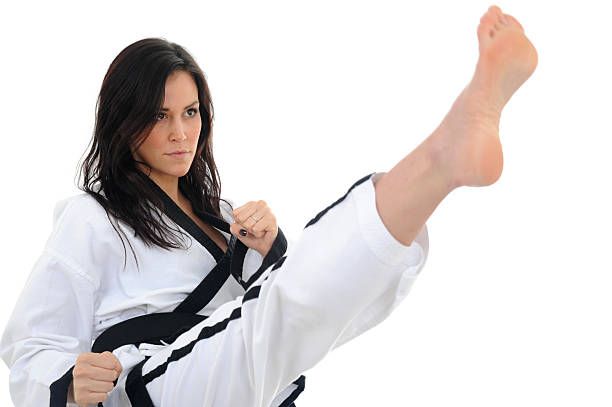 A Girl In Karate Uniform Isolated On White Background.