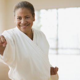 A Senior Woman Punching At The Camera.