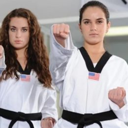 Two Female Fighters Punching At The Camera.