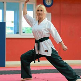 A Senior Female Martial Art Fighter In Her Training Session.