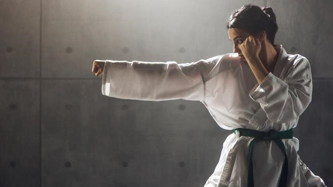 A Young Woman Martial Art Fighter On Her Action.